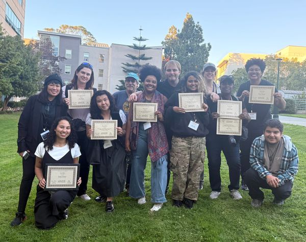 Students pose with awards.