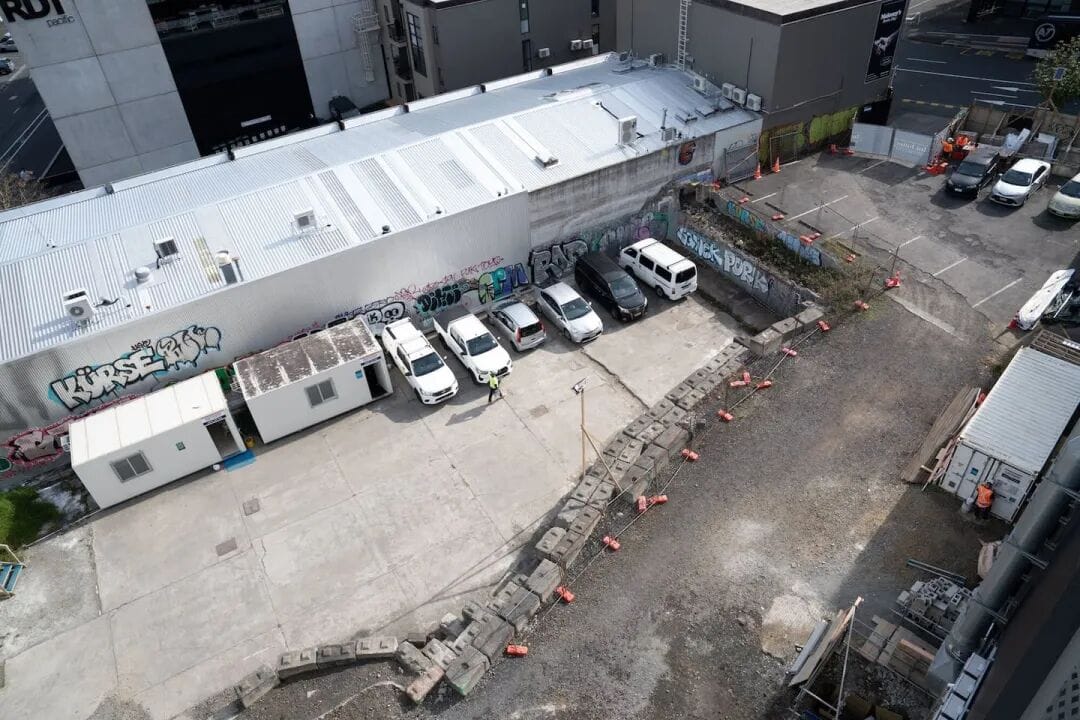 A new outdoor swimming pool will be built beside the existing gym on this empty site on Victoria St West. Photo / Anna Heath