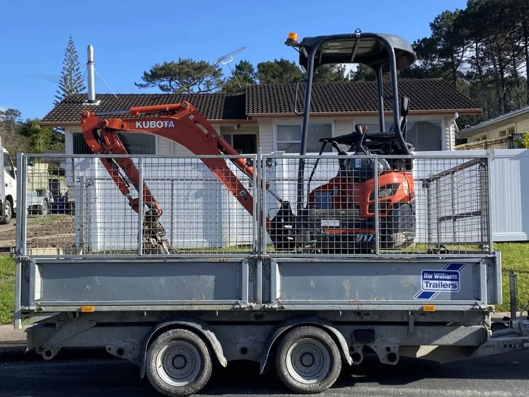 The digger and custom-built trailer stolen from Soltani's Green Bay property in November 2023. Photo / Supplied