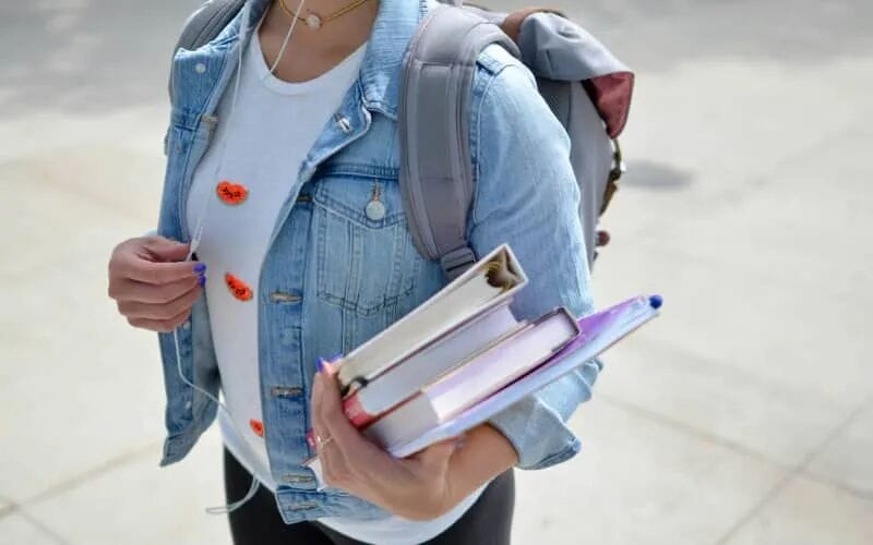 Student, backpack and books.