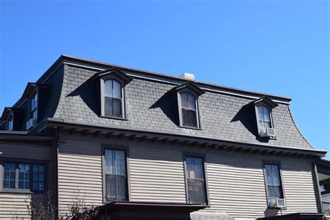 A house with a mansard roof design