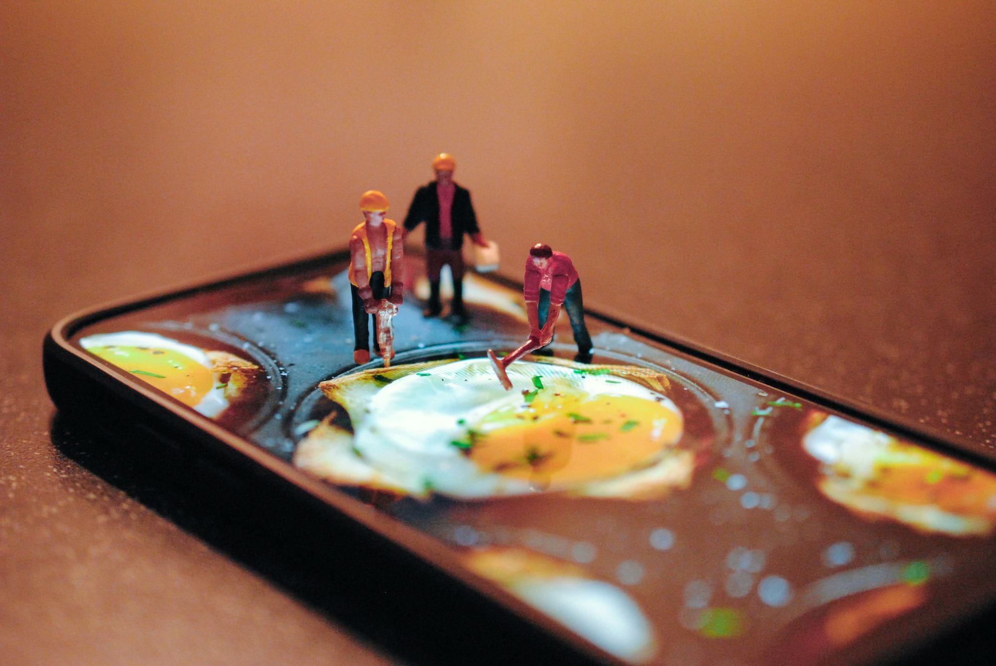 construction workers digging up an egg