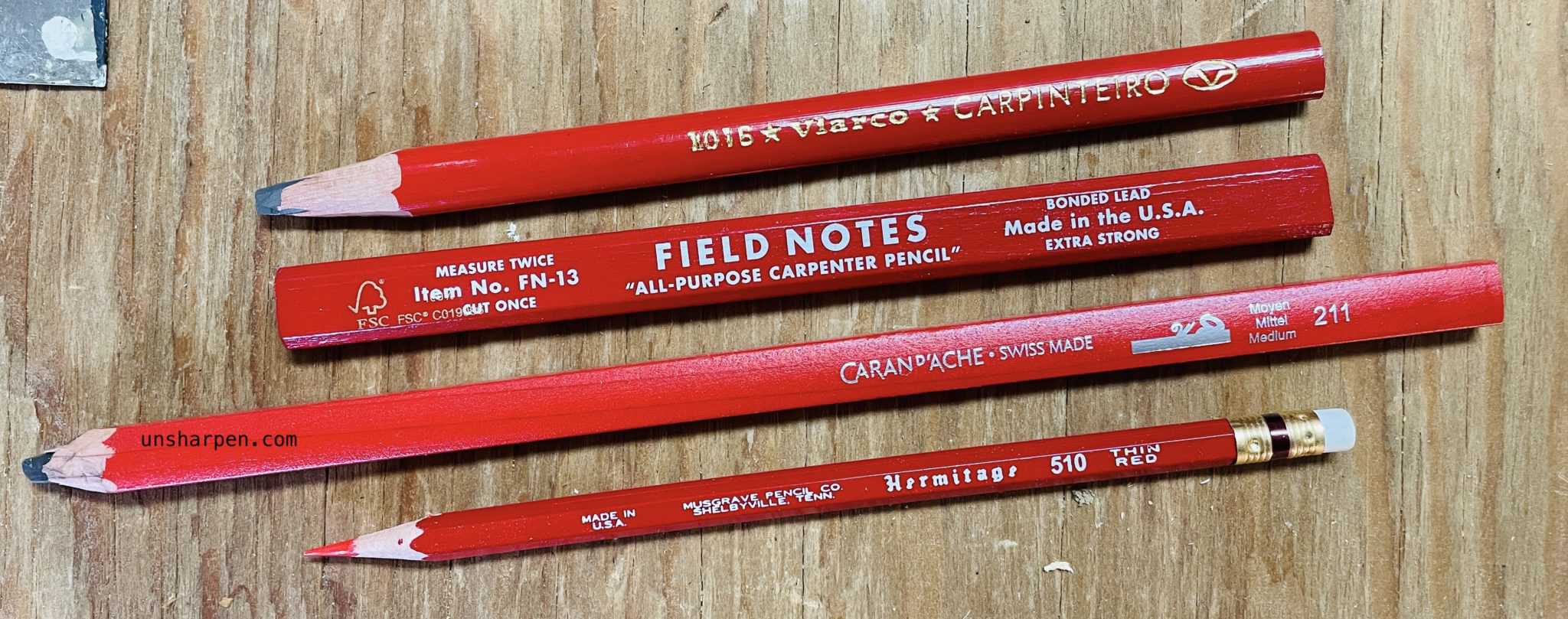 Red pencils on timber