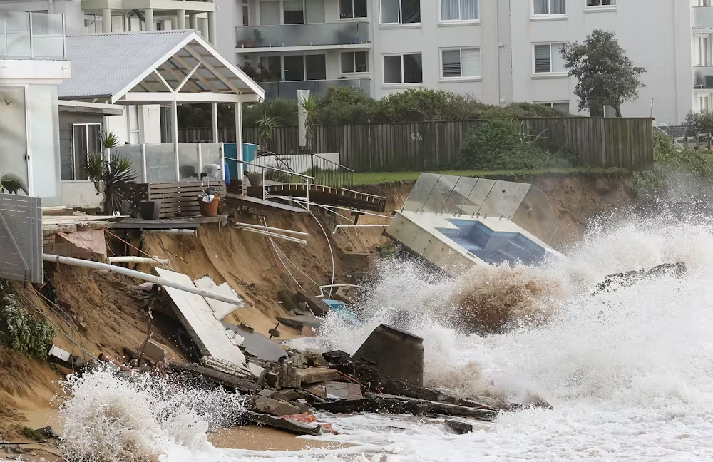 Pool and house falling into ocean