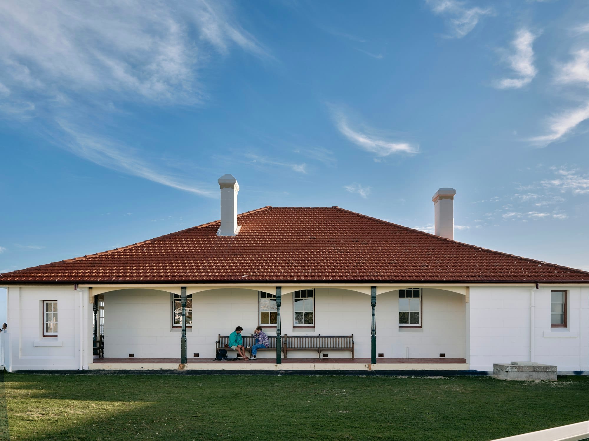 A large white house with a red roof