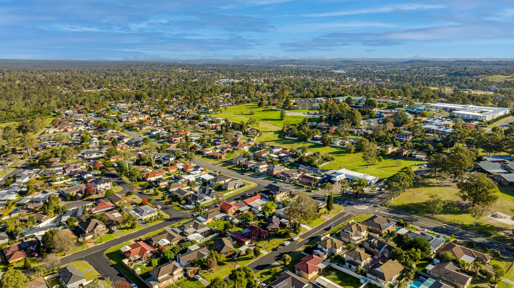 Aerial view of a suburban neighborhood with houses and trees