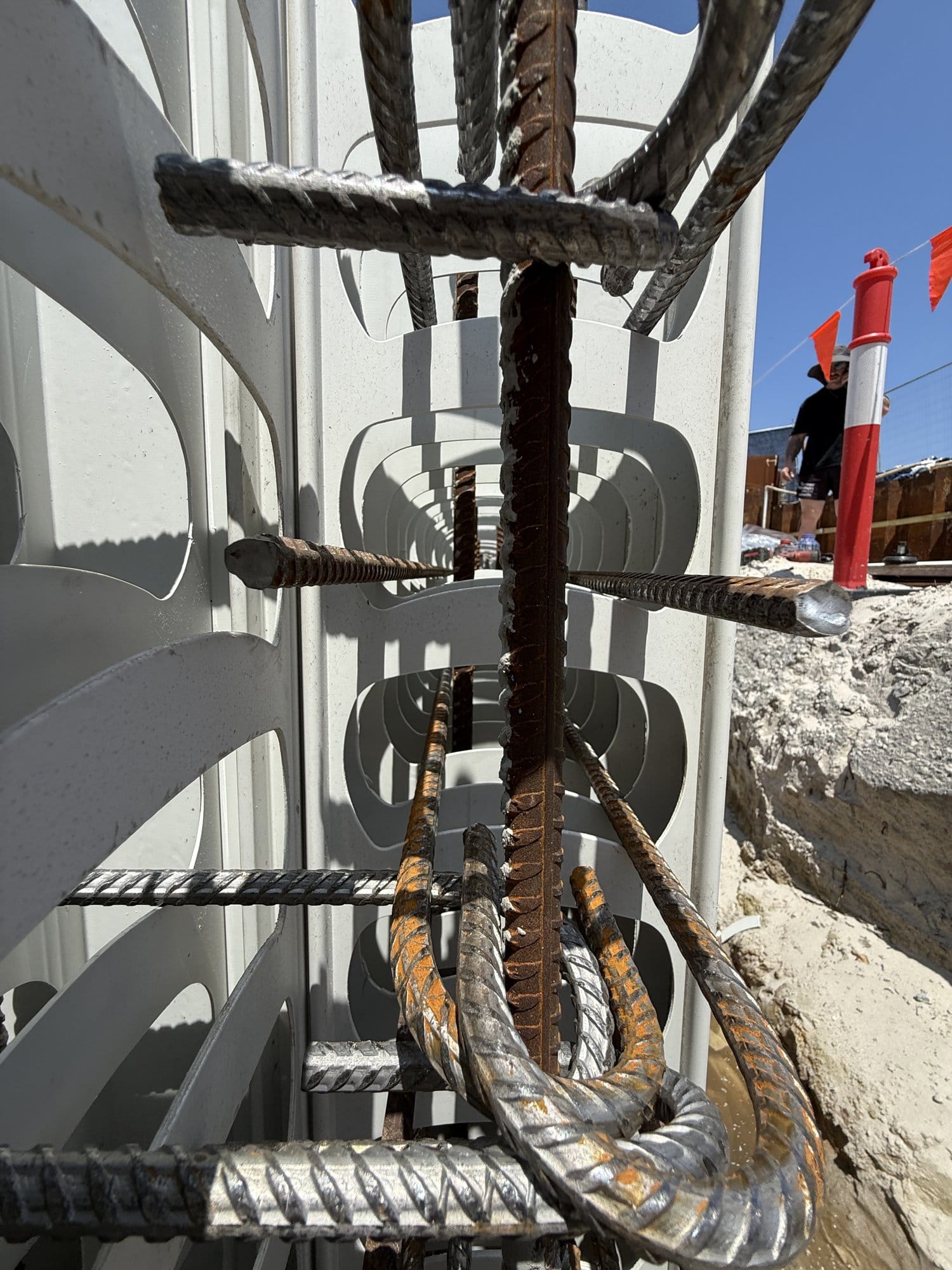 Reinforcement in a Rediwall tank wall: vertical bars, cogged bars and horizontals inside the PVC cells