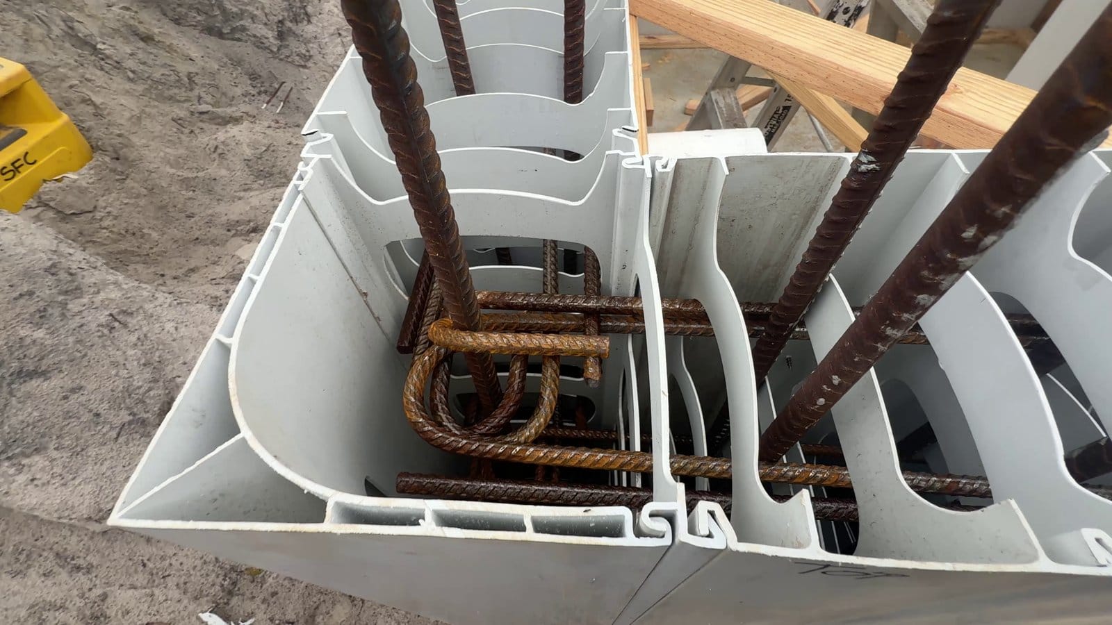 Hooked corner bars where two tank walls meet, inside the Rediwall cells