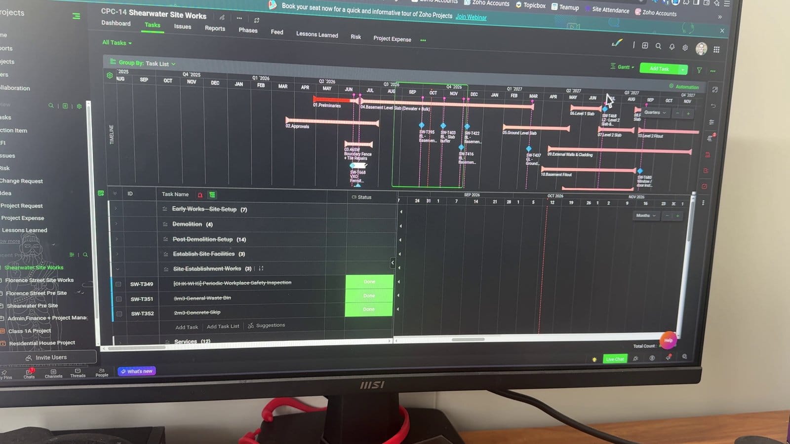 The project Gantt chart on the site office monitor
