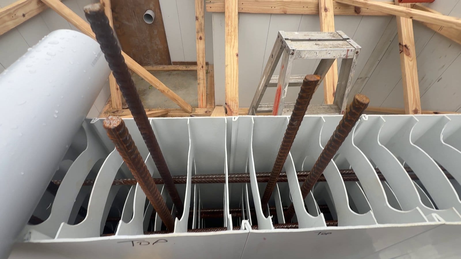 Reinforcement through the Rediwall cells, with the starter bars standing up for the slab