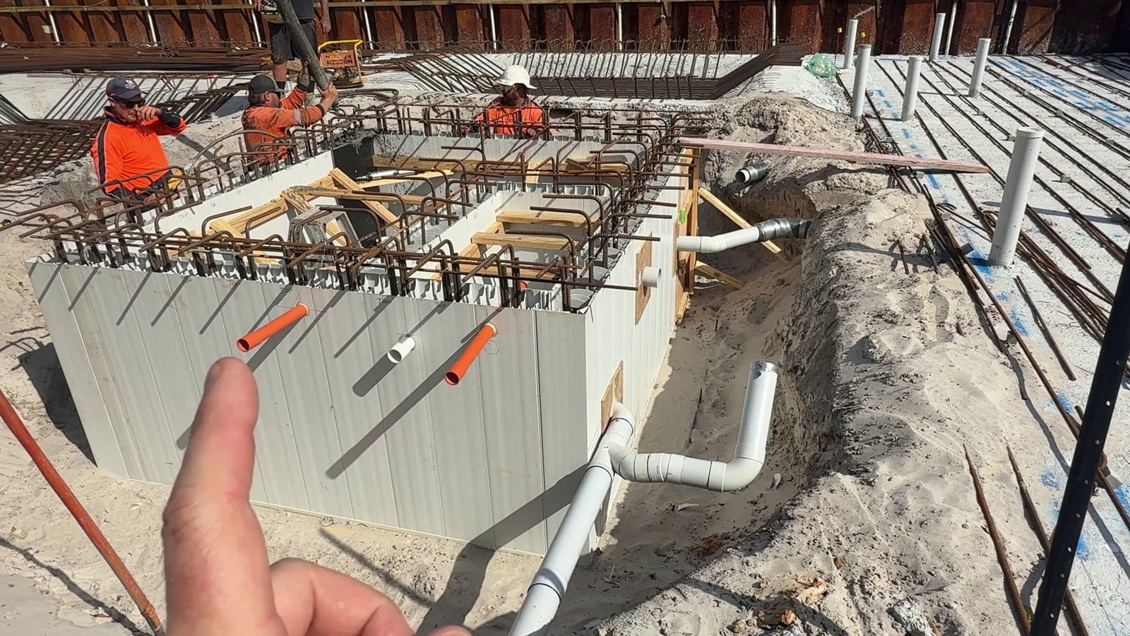 The tank walls just after the pour, with the starter bars standing up out of the core fill