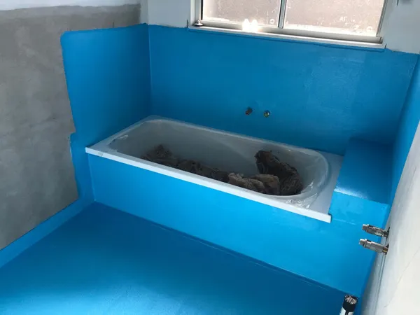 Blue waterproofing around tub