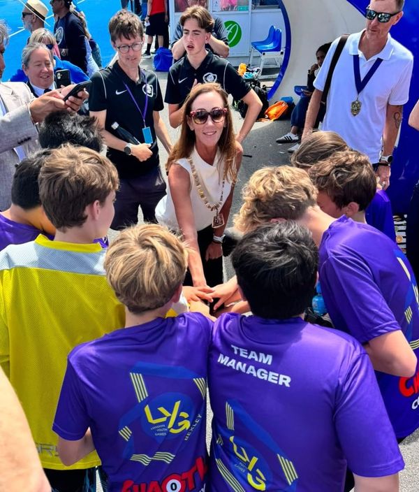 The Mayor of Bexley leading the Team Bexley boys huddle before their final game  