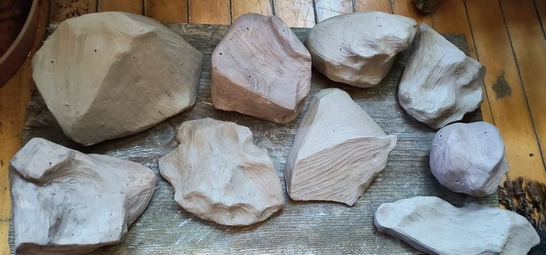                                                 sculptural rocks made from local clays