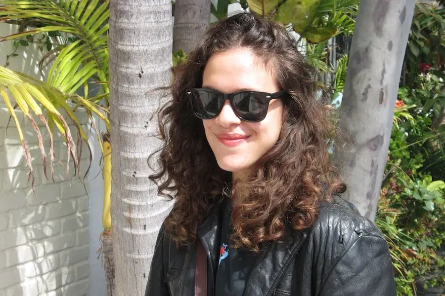 Portrait of Golda Grais wearing sunglasses and a leather jacket