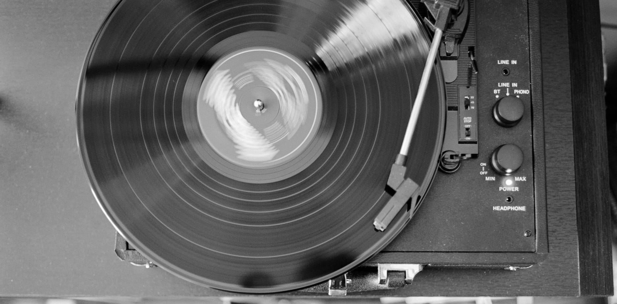 black and white photo of vinyl record player