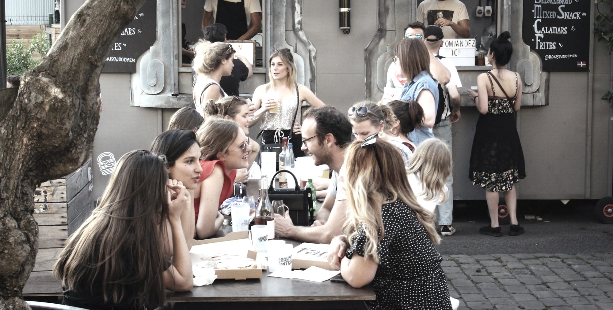 people sitting on chair in front of table