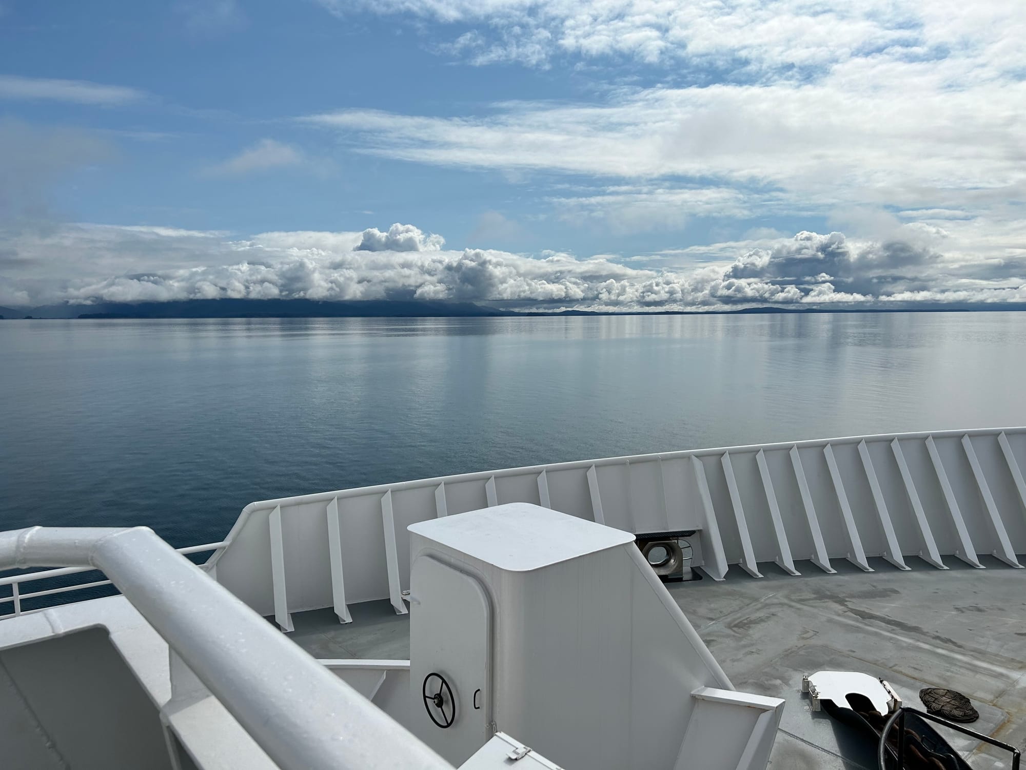 view from the Alaska ferry, looking across Chatham Strait on a calm afternoon