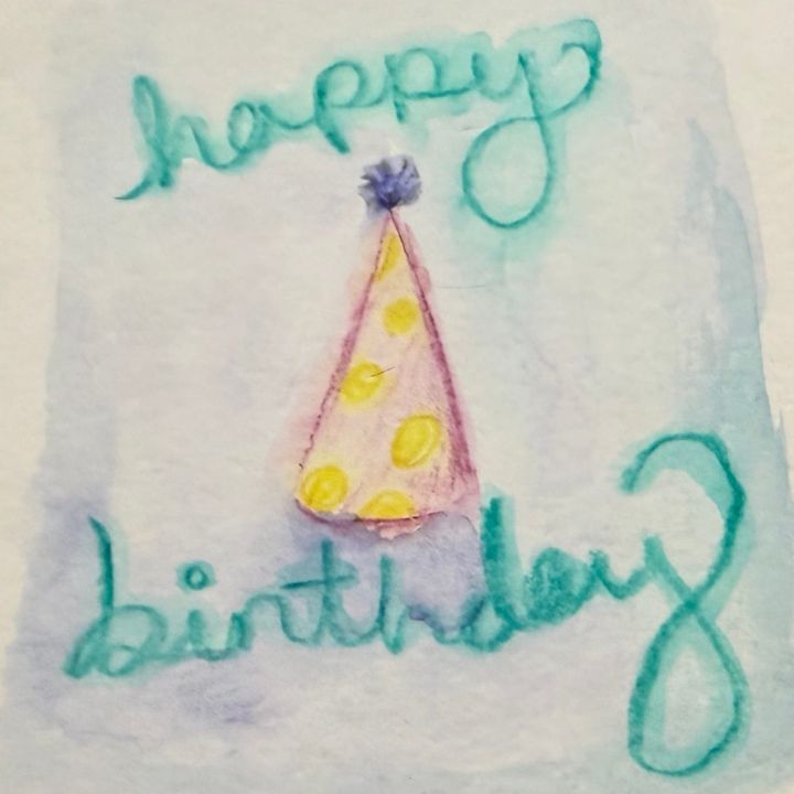 Watercolor pencil sketch of a birthday hat by Julia Rios. Cursive text reads Happy Birthday