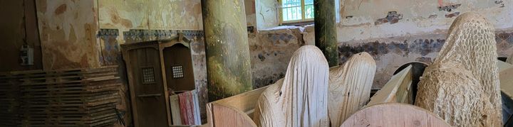 Sculptures of shrouded figures in the ruins of a defunct church. [Taken at the Kostel Svatého Jiří]
