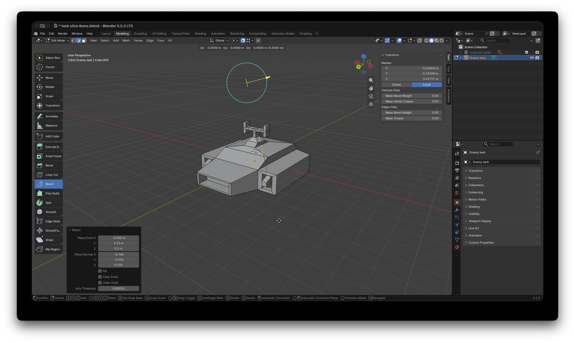 Blender UI with a simple model of a hover tank cut by a line from the Bisect tool.