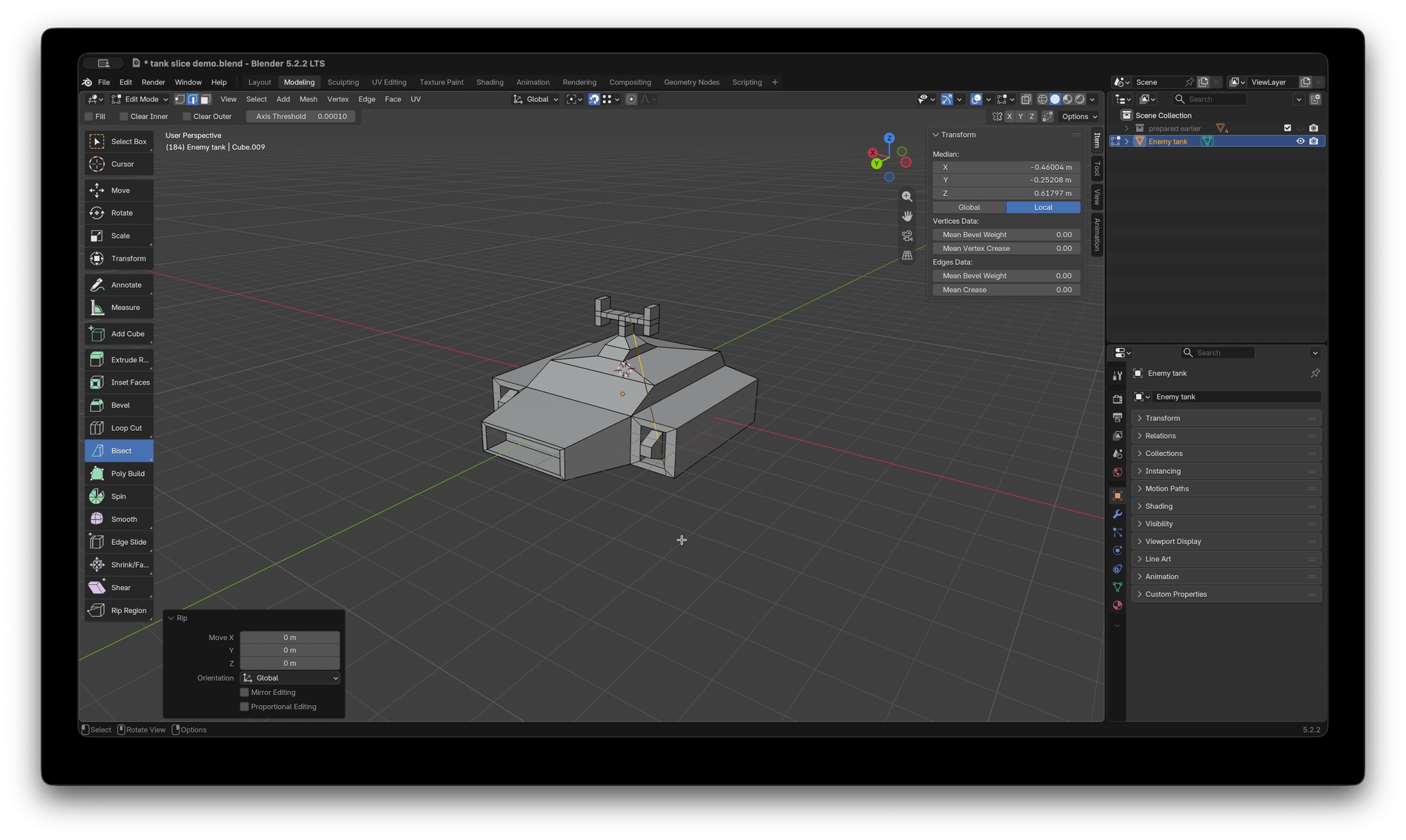 Blender UI with a simple model of a hover tank cut in two pieces, edit mode selected.