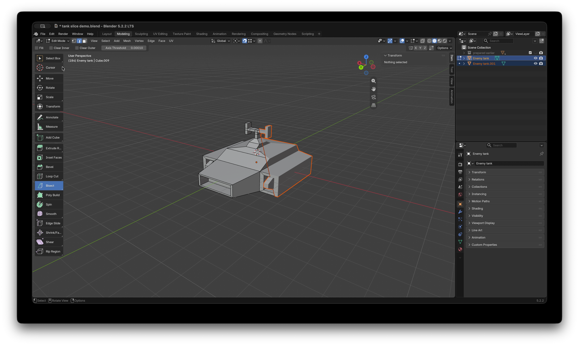 Blender UI with a simple model of a hover tank split in to two objects, in edit mode.