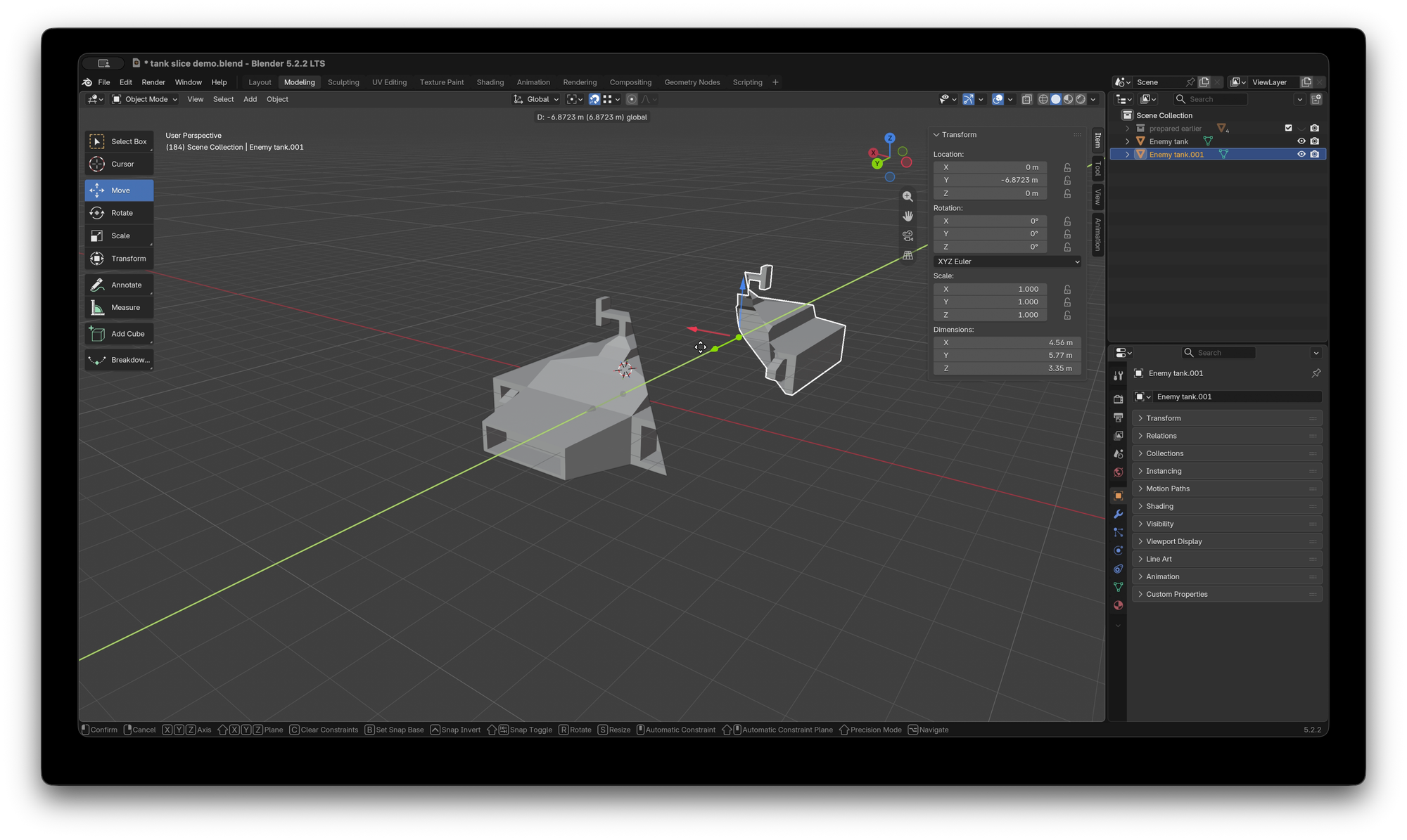 Blender UI with a simple model of a hover tank split in to two objects, one moved away from the other along the Y axis, in object mode.