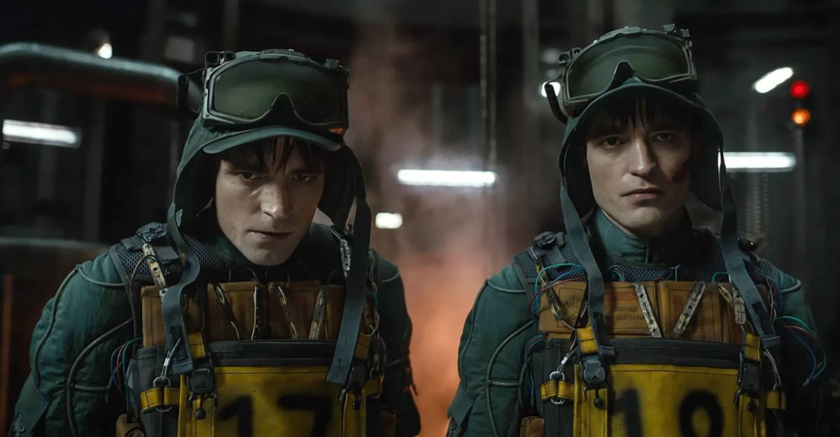 Two people in military-style helmets with goggles, wearing heavy tactical gear with yellow chest packs numbered 17 and 19.