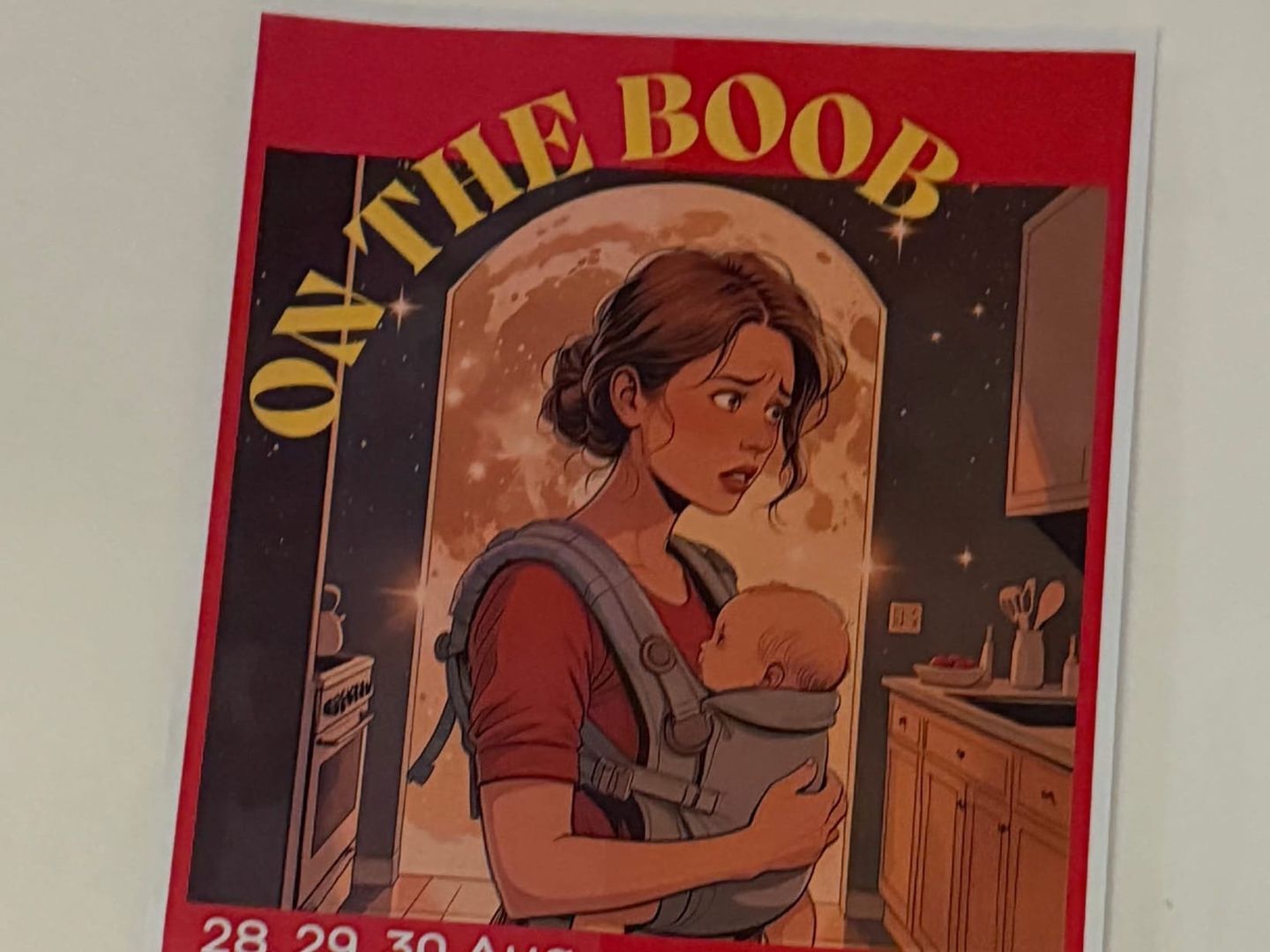 Illustrated poster titled "ON THE BOOB" showing a tired mother carrying a baby in a chest carrier in a kitchen at night.