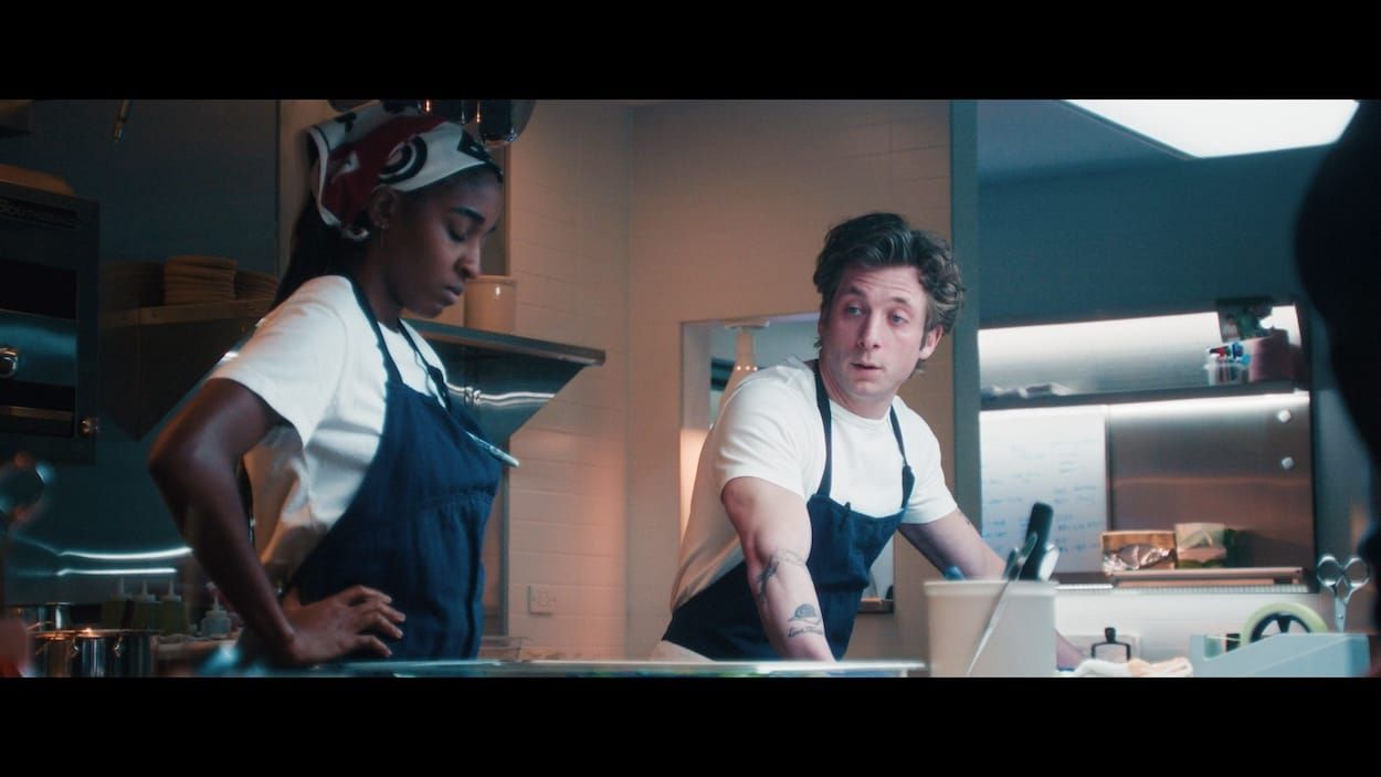 Sydney and Carmy stand in a professional kitchen in The Bear season 5 finale.
