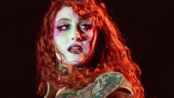 American musician Chappell Roan performing in Paris, France on 20 August 2025 - A Redhead white woman in rococo drag makeup, onstage performing.