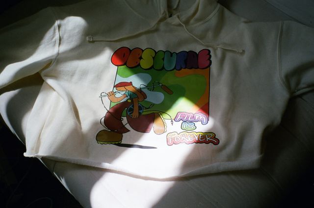 Cream OBSCURAE Film Is Forever hoodie with colourful Gabriel Silva artwork.