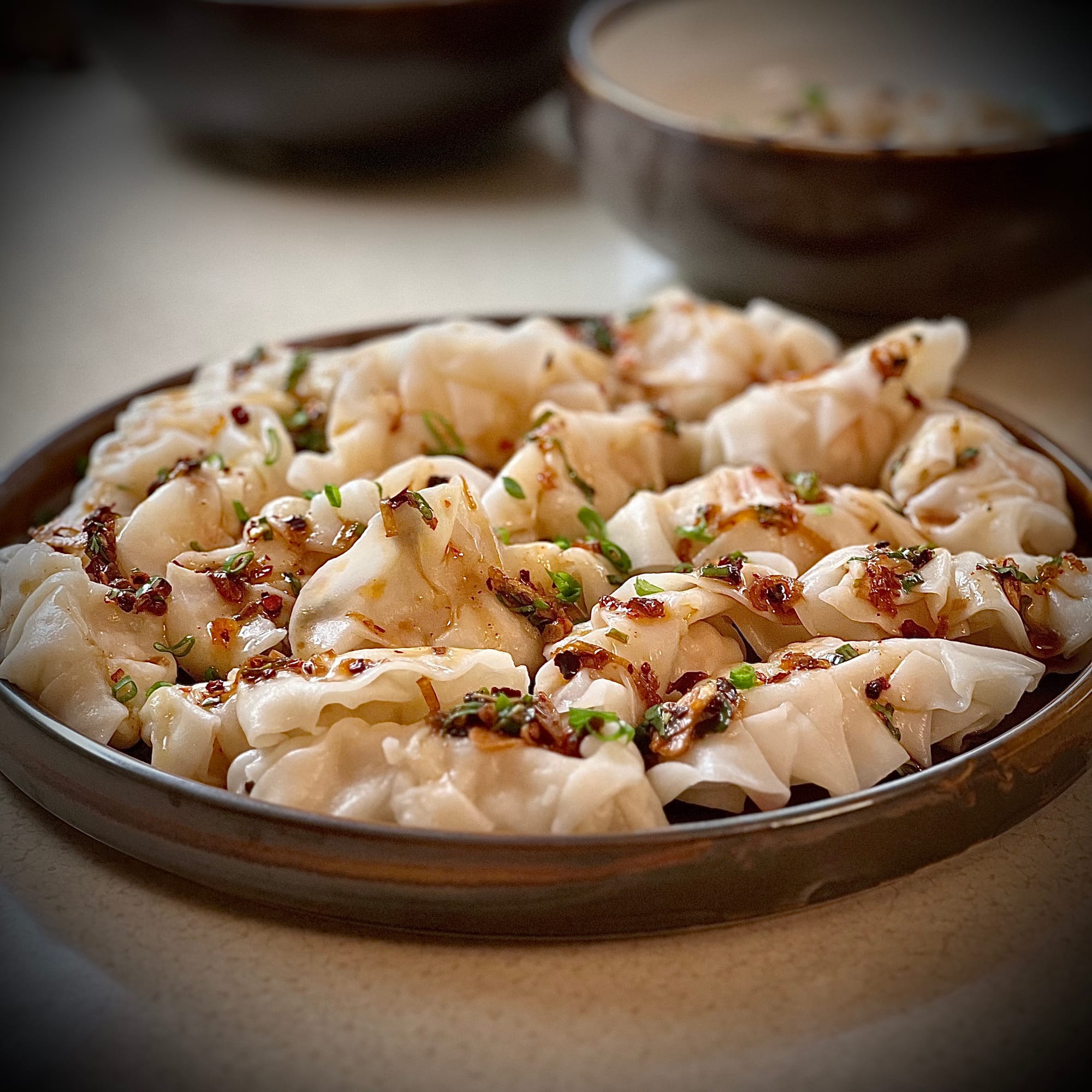 Steamed Asian Dumplings Topped with Homemade Chili Crisp