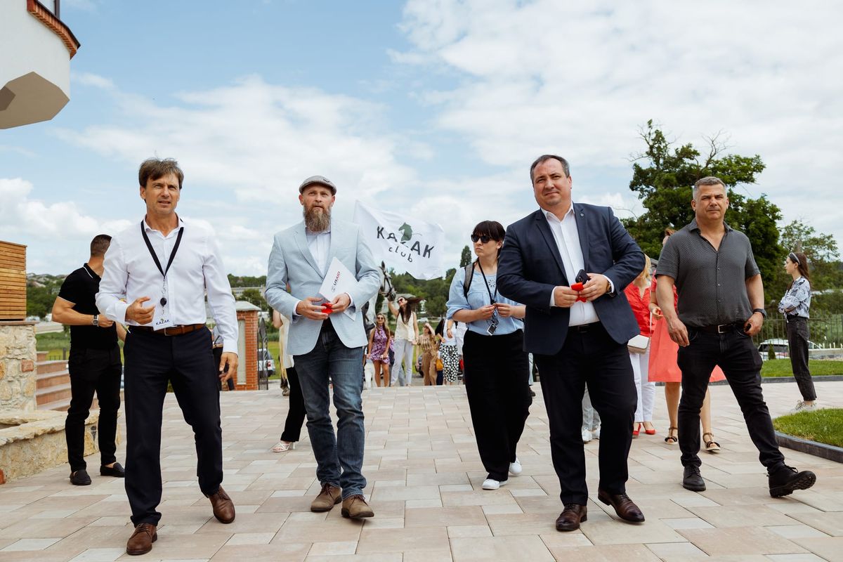 Group Walking toward Venue after Cutting Ribbon for Tourism Center