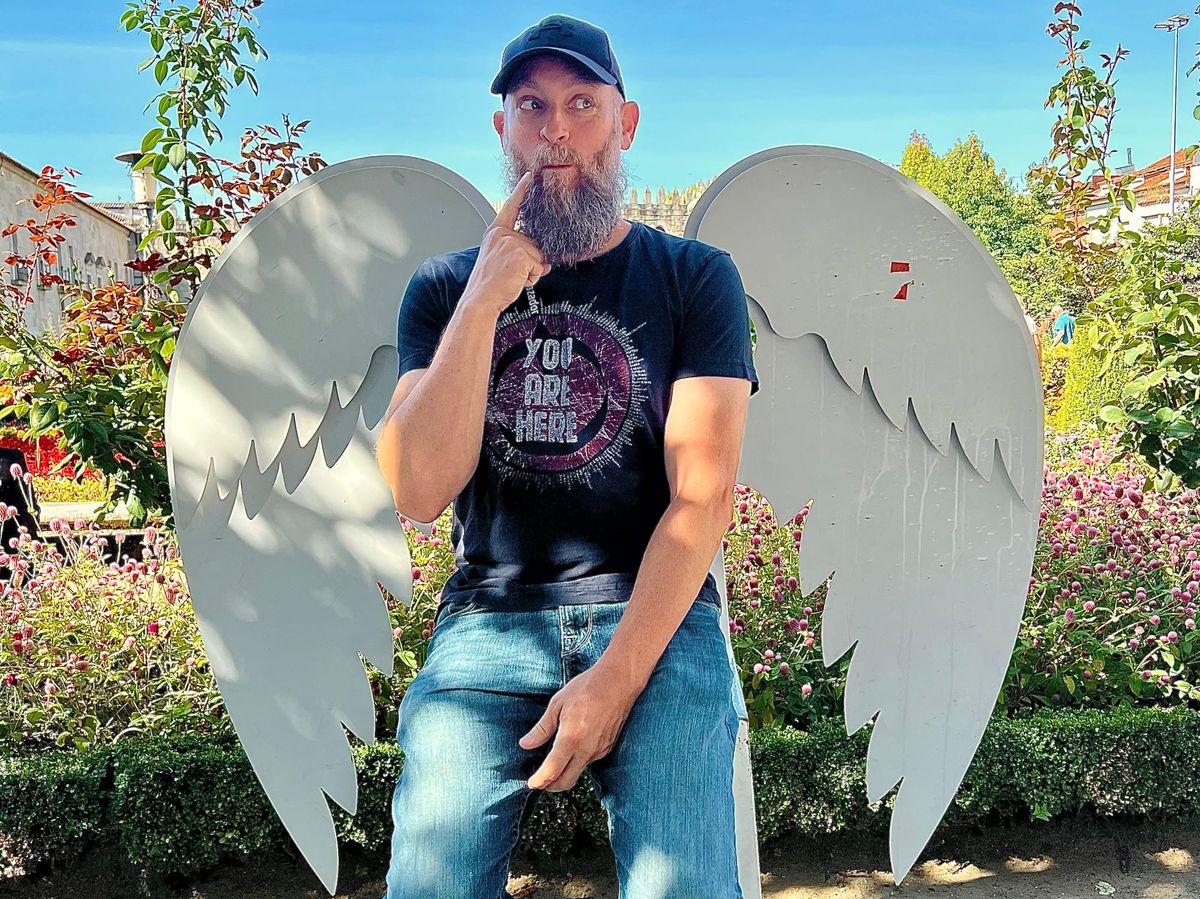 Man in Front of Angel Wings