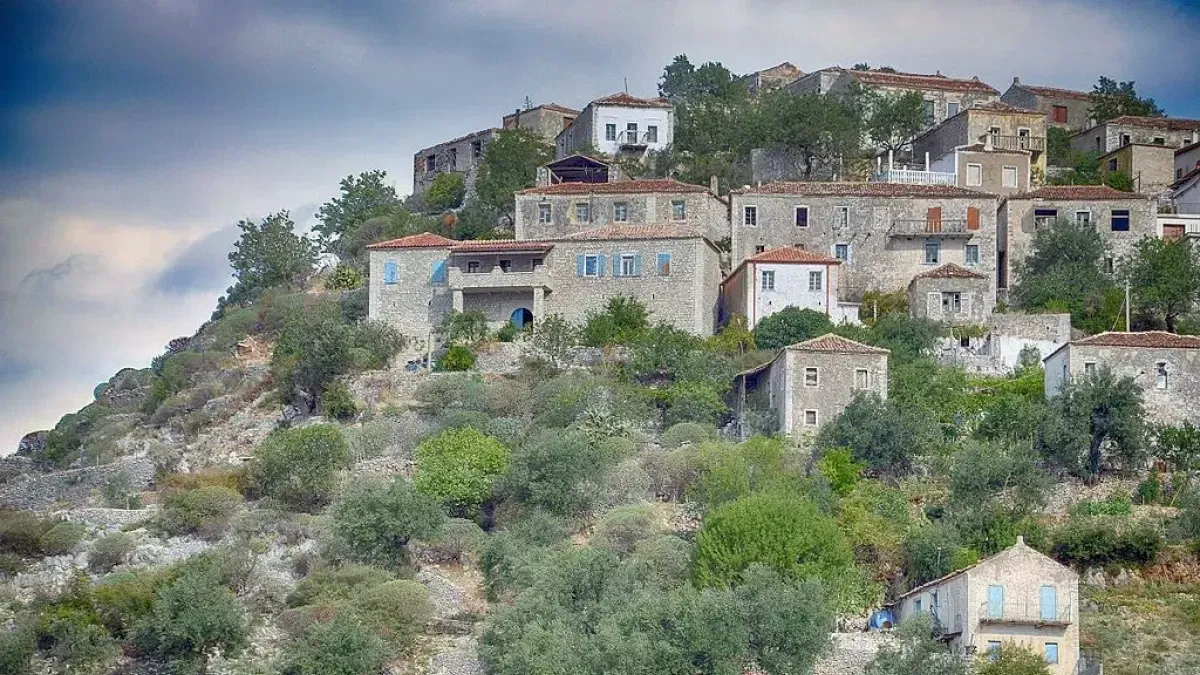 Stone houses on a hillside in Qeparo, a traditional coastal village in southern Albania overlooking the Ionian Sea.