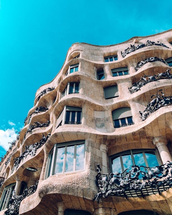 Curved, organic stone exterior of Casa Milà (La Pedrera) which is located in the Gràcia neighborhood in Bacelona. One of the best areas to stay in.