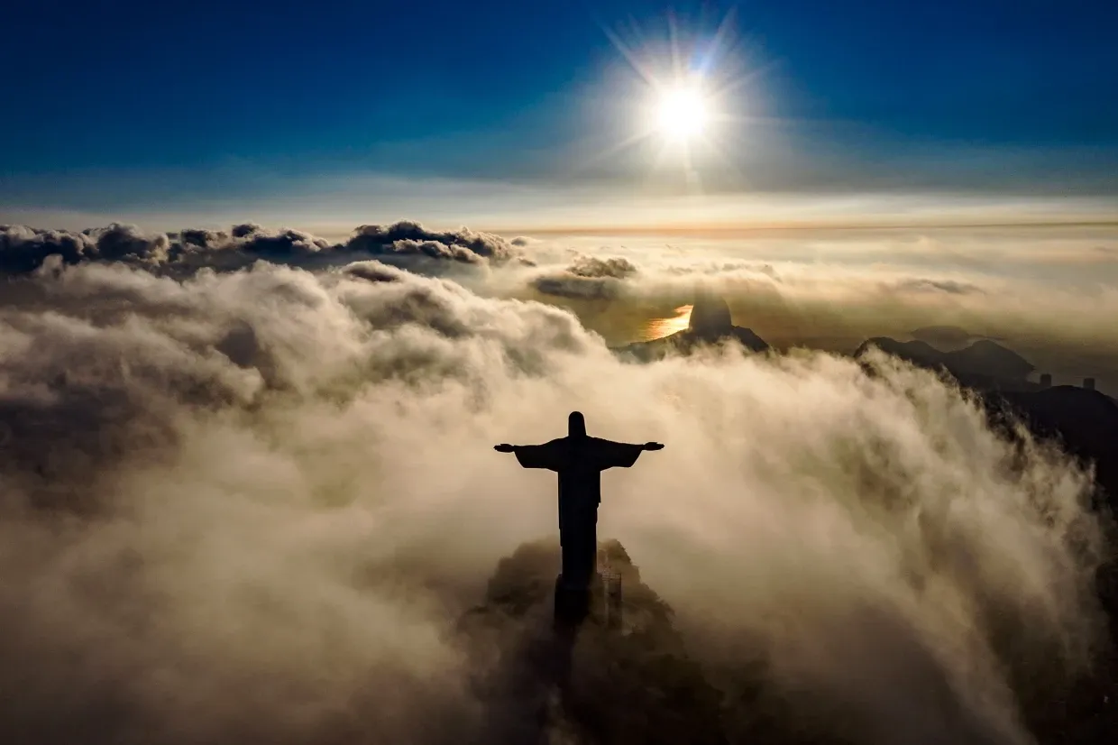 View of Christ the Redeemer in Rio de Janeiro sitting above the clouds. 