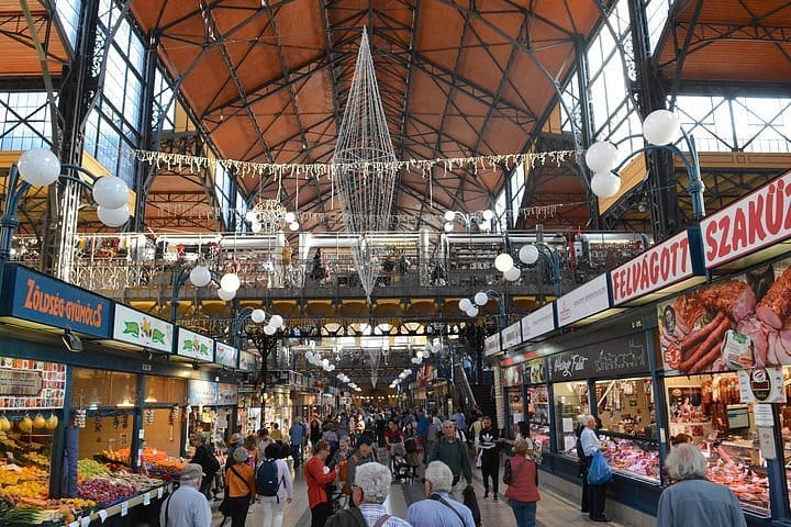 People walking through the central market hall in Budapest.