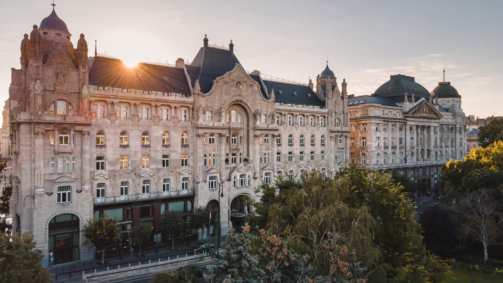 Trees lining the street in front of the Four Seasons Hotel Gresham Palace in Budapest.