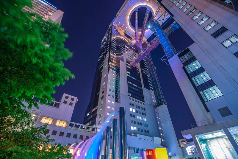 The Umeda Sky Building is a very tall modern building with a platform at the top.