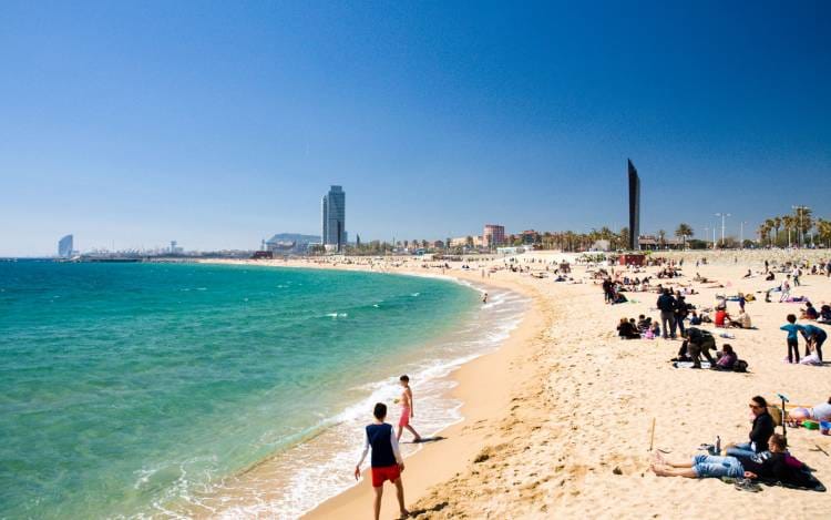 People playing on the beach in Barcelona 