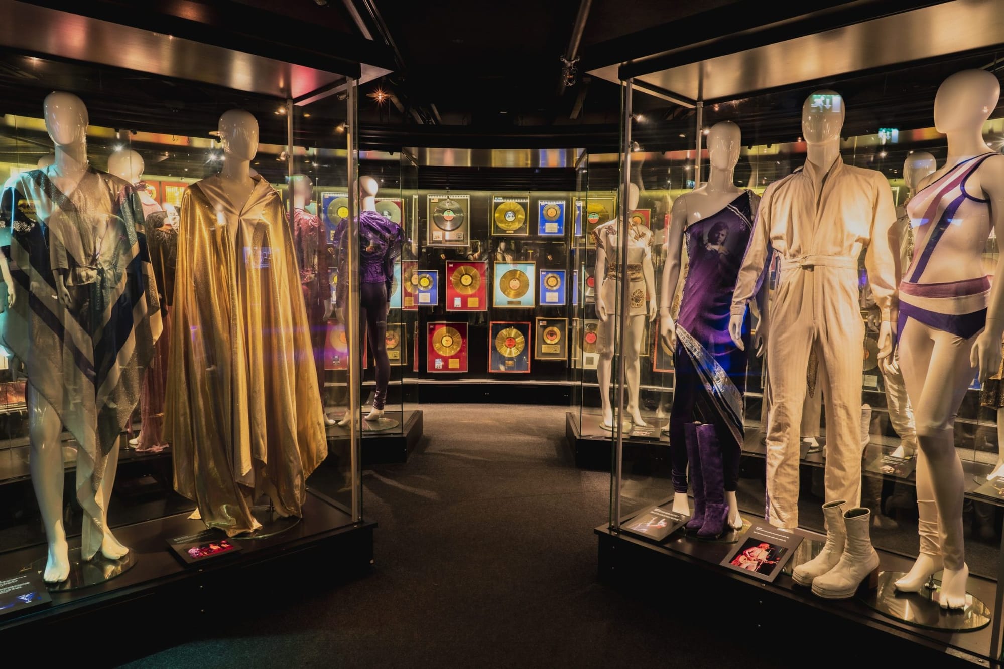 mannikins wearing historic clothes inside ABBA The Museum in Stockholm.