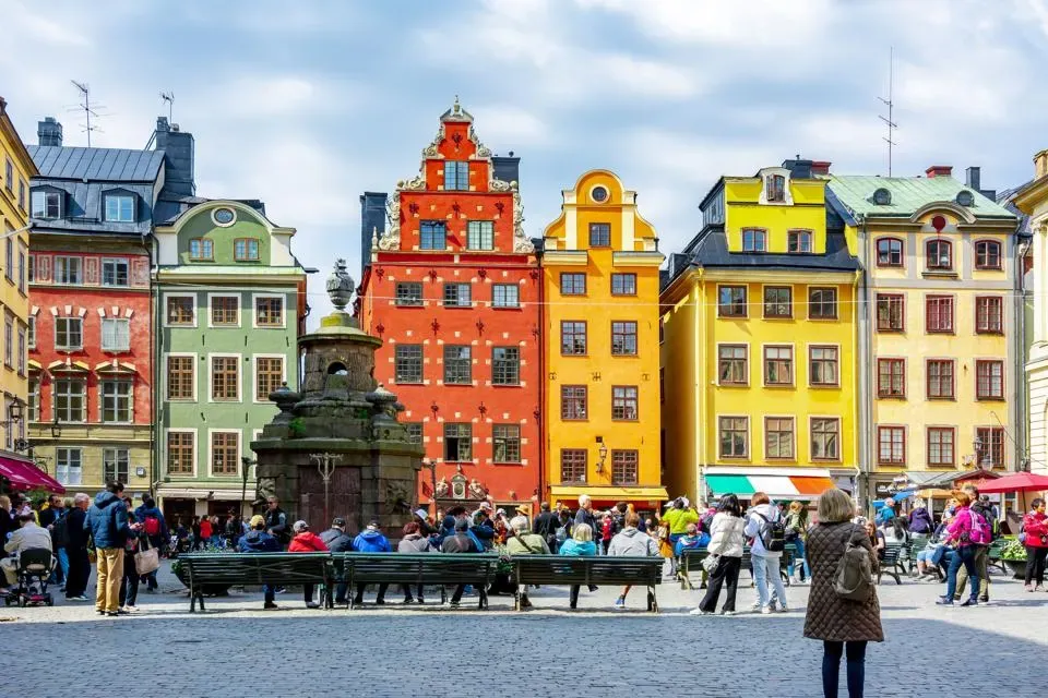 Colorful buildings with tourist walking around in Gamla Stan (Old Town), Stockholm, Sweden.