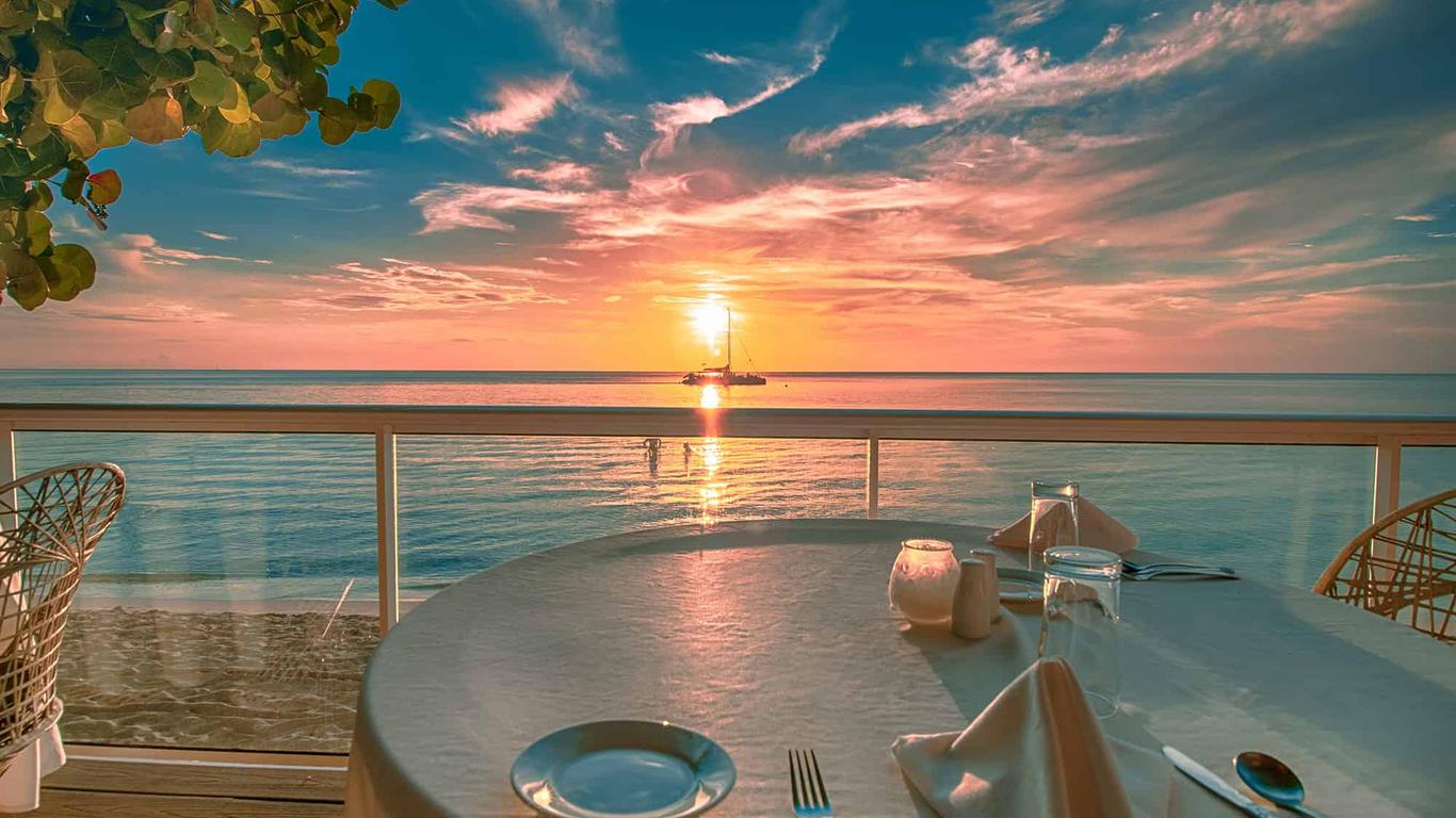 Sunset over the ocean at Travellers Beach Resort Negril, Jamaica.