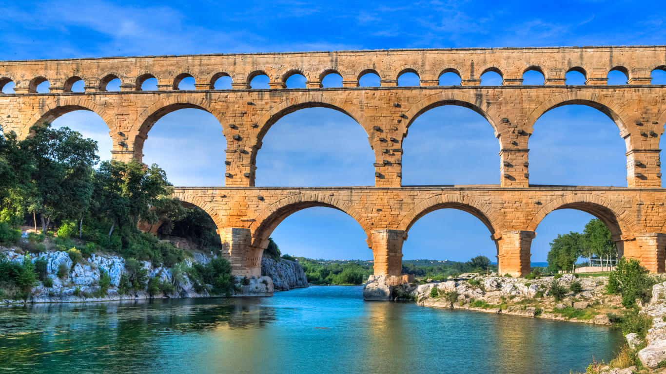 view from the water and underneath the ancient roman road of Pont du Gard