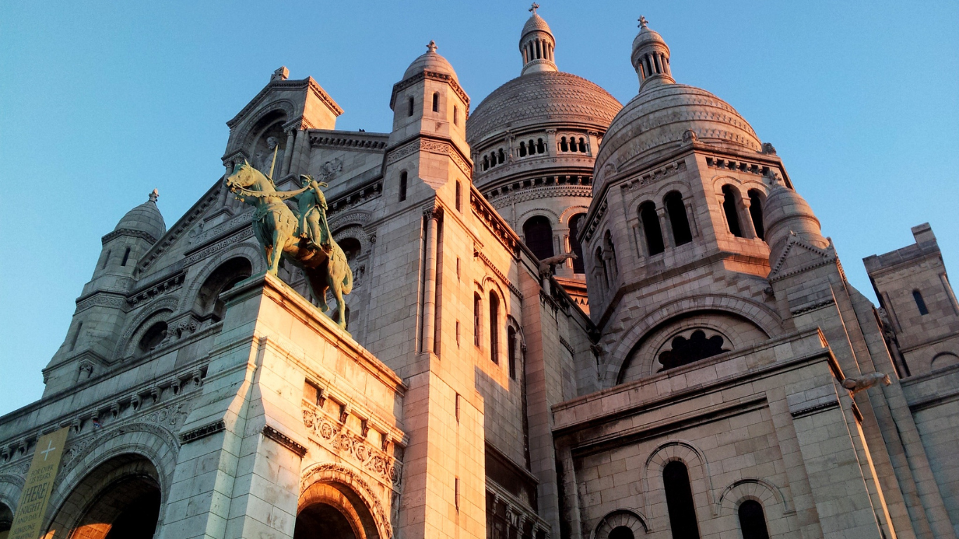 Sacré-Cœur Basilica up close looking up at the top of the impressive structure.