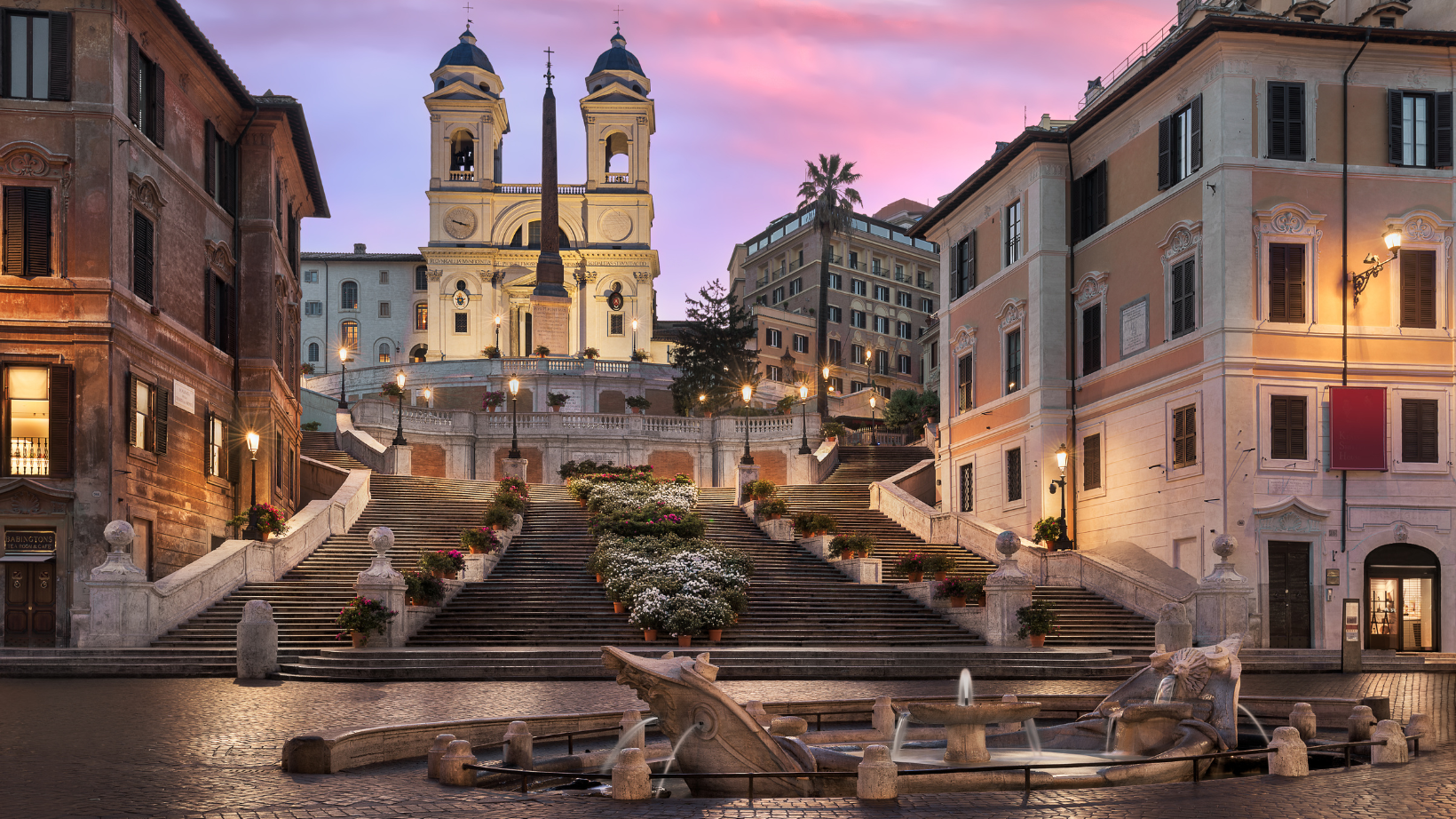 A grand, Baroque-style staircase connecting Piazza di Spagna to the Trinita dei Monti church.