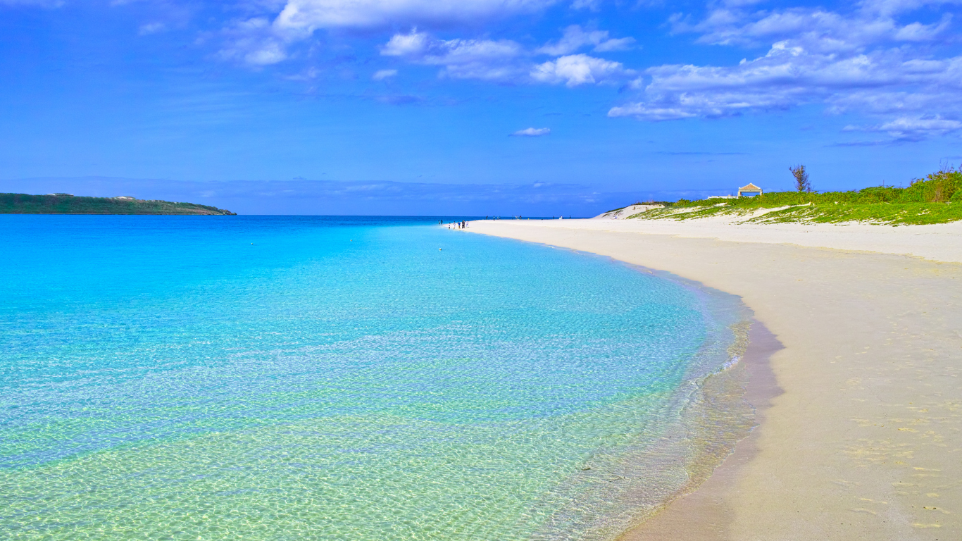 A white sand beach with beautiful crystal clear blue waters.
